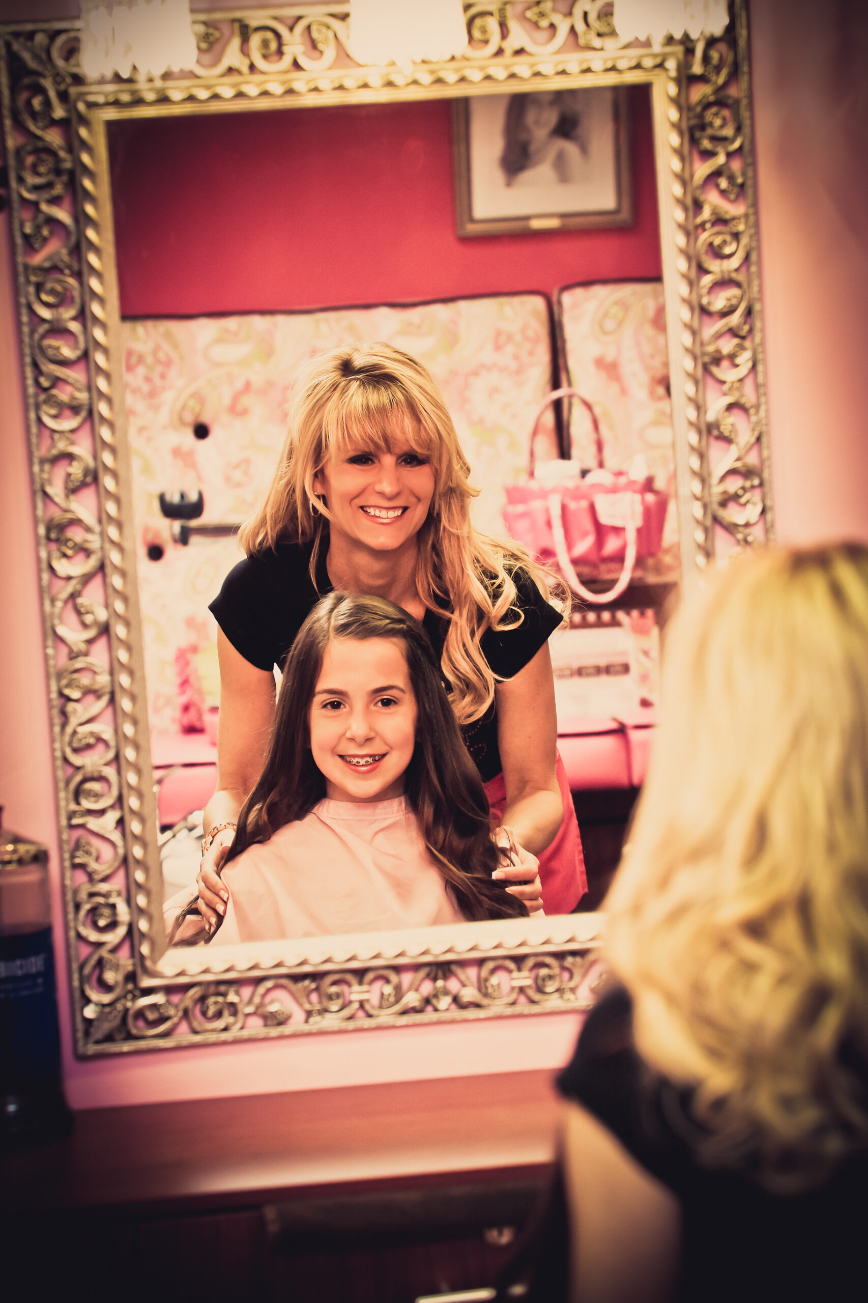 girl getting ready in front of mirror
